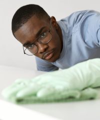 medium-shot-man-servant-cleaning-table